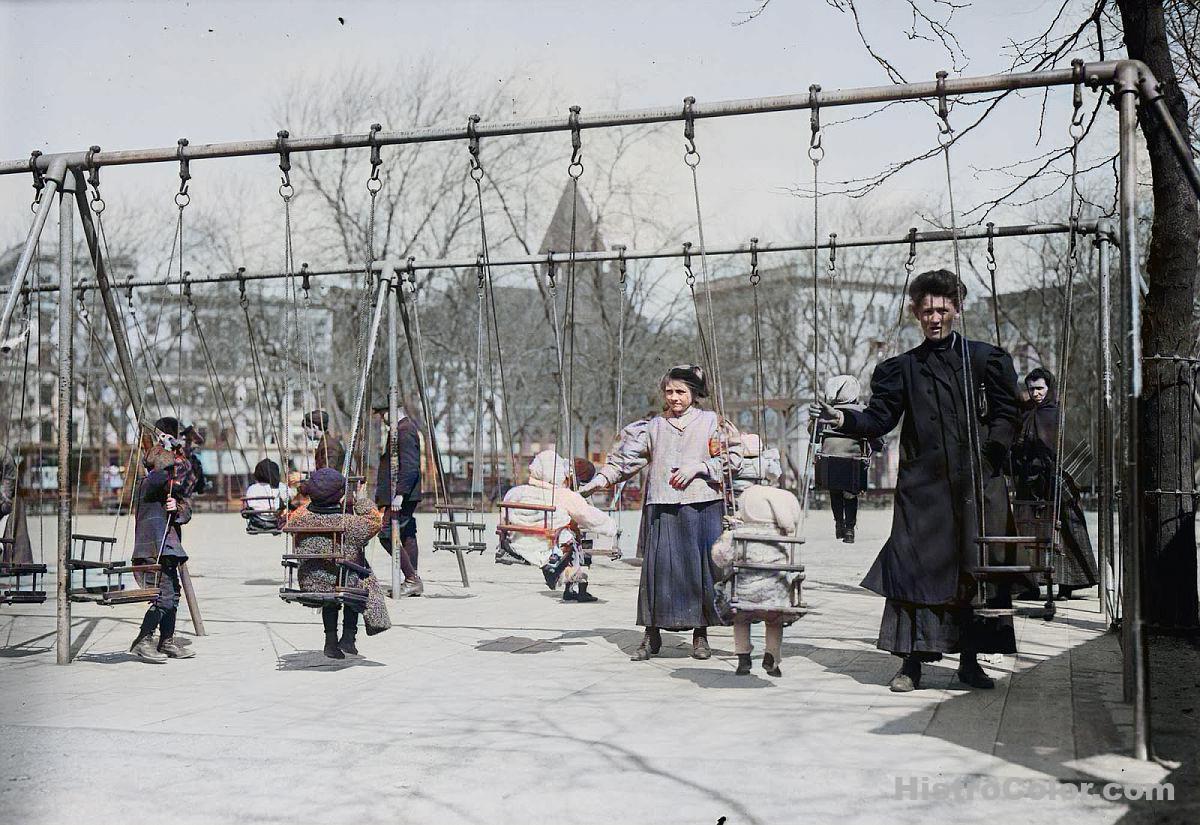 Children Play On Swings